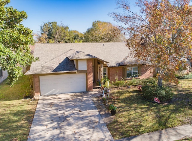 single story home with a front yard and a garage