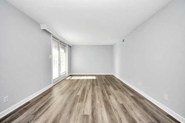 spare room featuring hardwood / wood-style floors