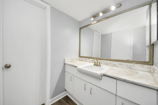 bathroom featuring wood-type flooring and vanity