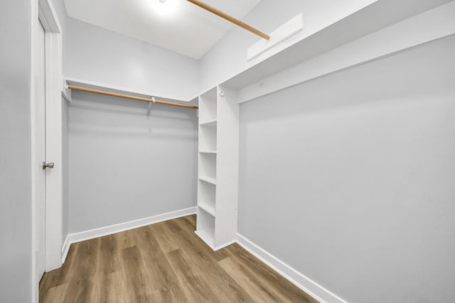 walk in closet featuring hardwood / wood-style floors