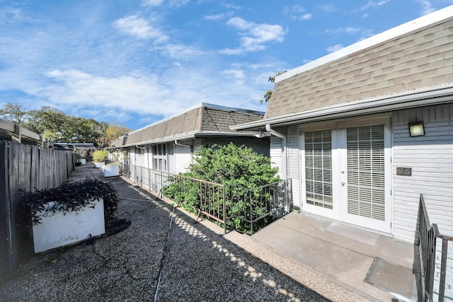 view of property exterior with french doors