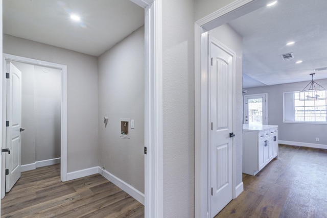 hall with dark hardwood / wood-style flooring