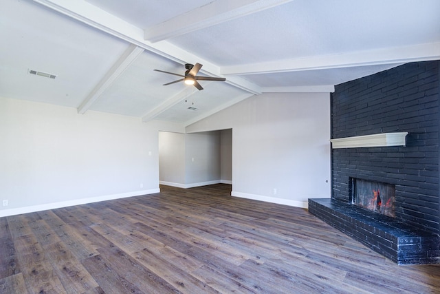 unfurnished living room featuring ceiling fan, lofted ceiling with beams, a fireplace, and hardwood / wood-style flooring