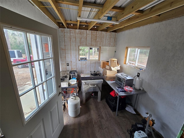 interior space with a wealth of natural light and hardwood / wood-style floors