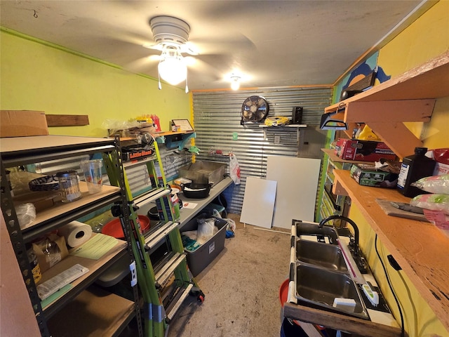 storage featuring ceiling fan and sink