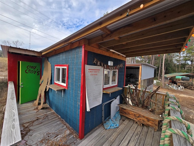 wooden deck featuring an outdoor structure