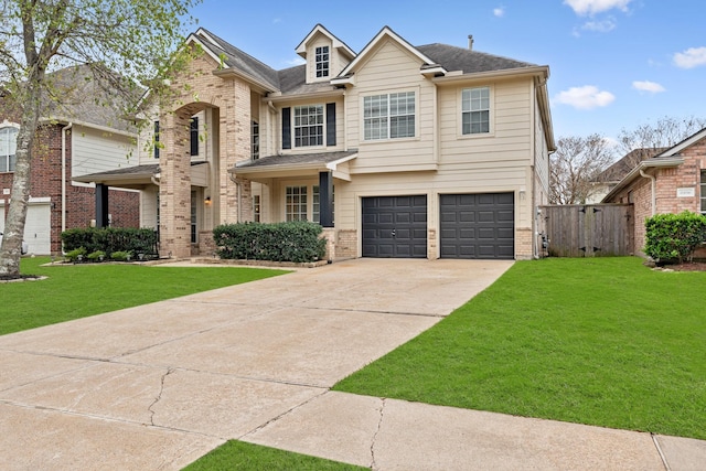 view of front facade with a garage and a front yard