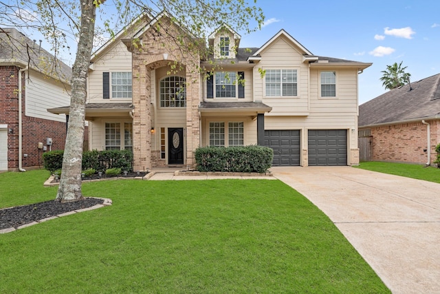 view of front of home featuring a garage and a front lawn