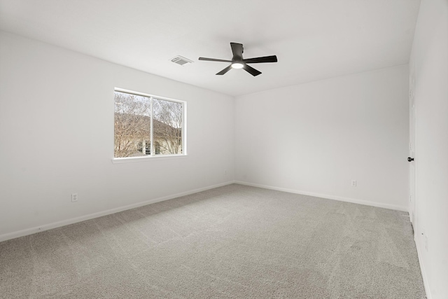 empty room with carpet and ceiling fan