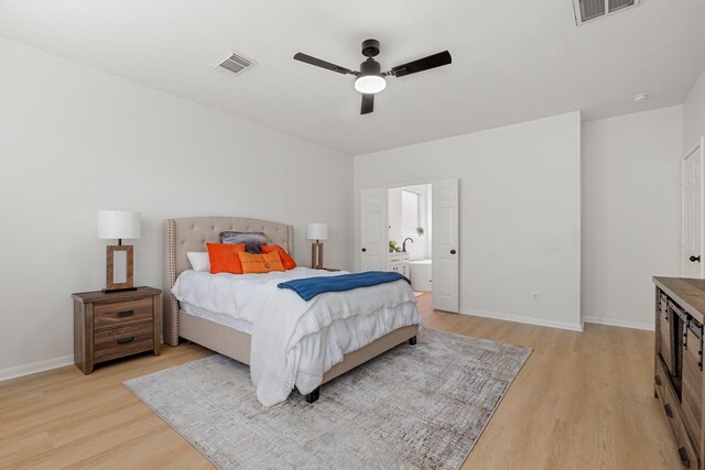 bedroom with ceiling fan and light hardwood / wood-style flooring