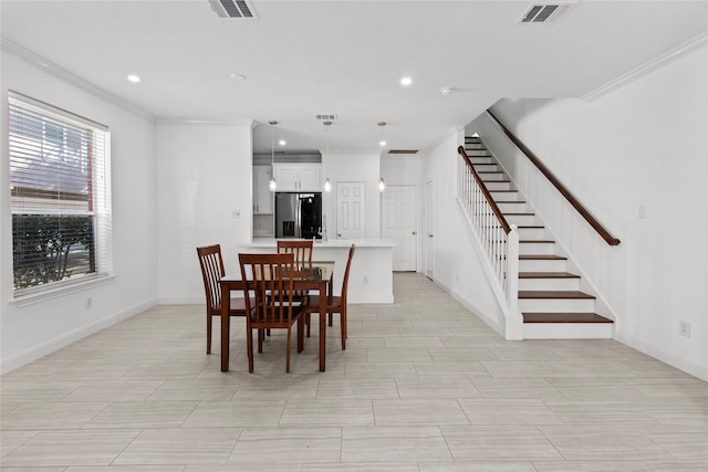 dining room featuring ornamental molding