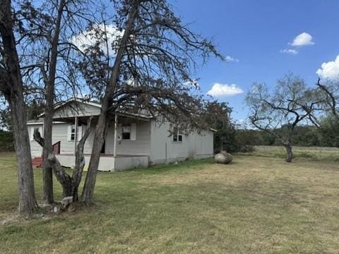 view of side of property featuring a lawn