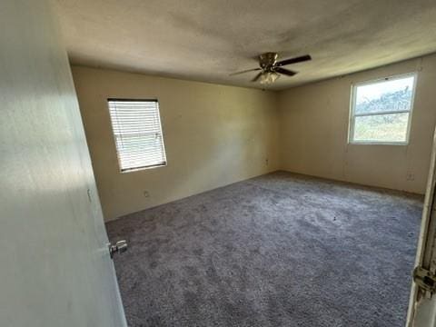 unfurnished room featuring carpet flooring and ceiling fan