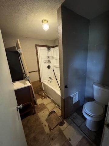 full bathroom with a textured ceiling, vanity, shower / bath combination, and toilet