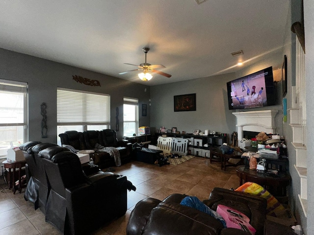 living room with tile patterned floors and ceiling fan