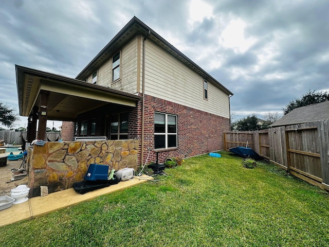 view of home's exterior with a lawn