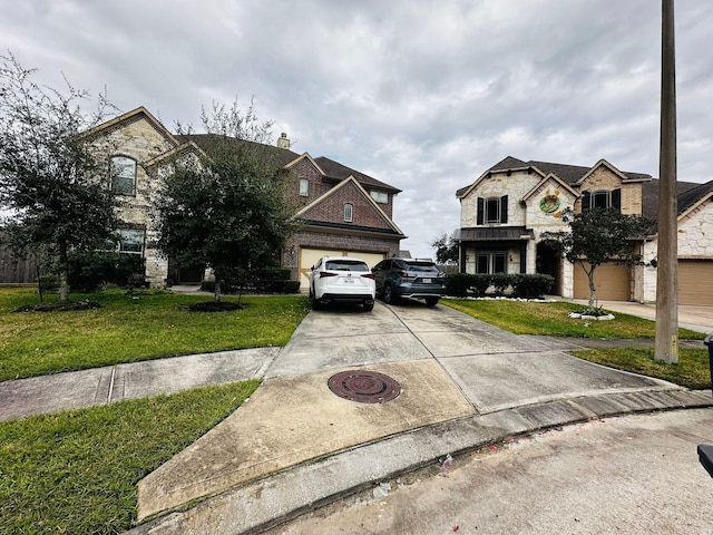 view of front of home featuring a garage and a front yard