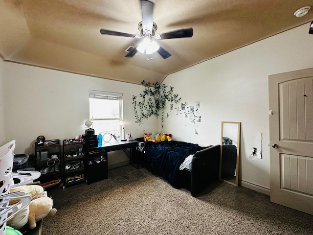 carpeted bedroom with ceiling fan and lofted ceiling