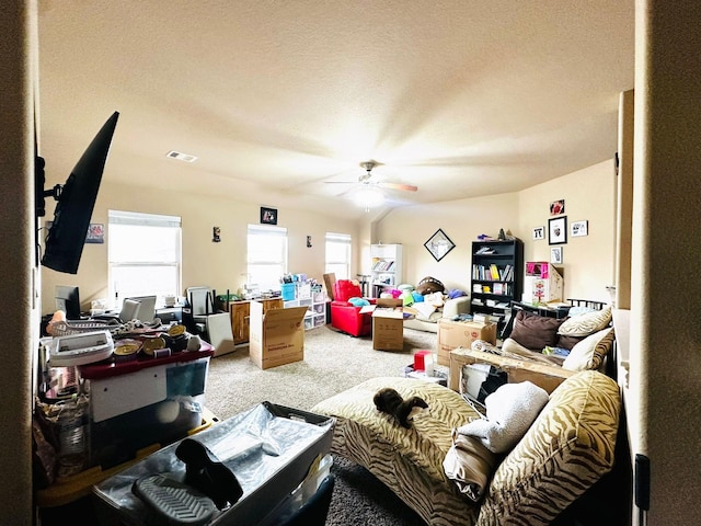 living room featuring ceiling fan and carpet floors