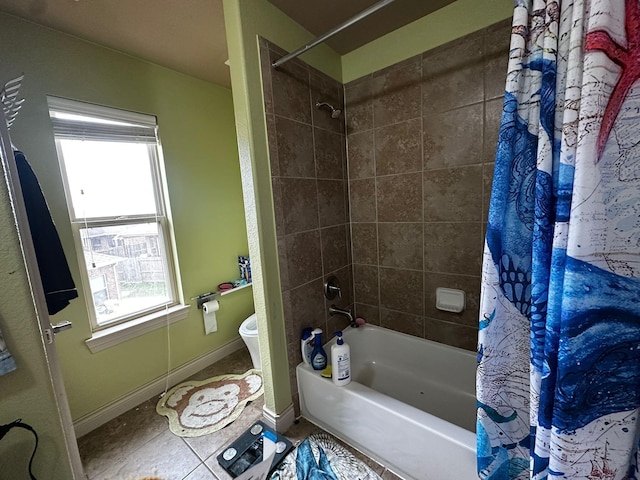 bathroom featuring a wealth of natural light, tile patterned flooring, shower / bath combo, and toilet