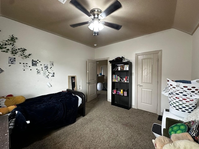 carpeted bedroom featuring vaulted ceiling and ceiling fan