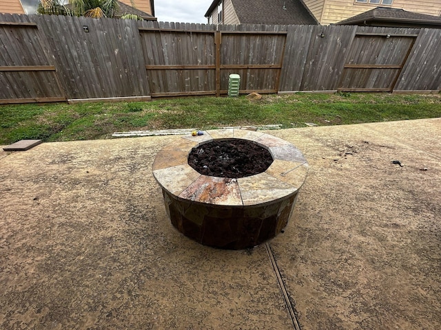 view of yard with a patio and an outdoor fire pit