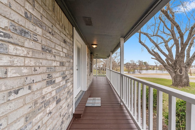 balcony featuring a water view