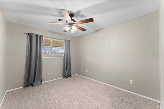 carpeted empty room with ceiling fan