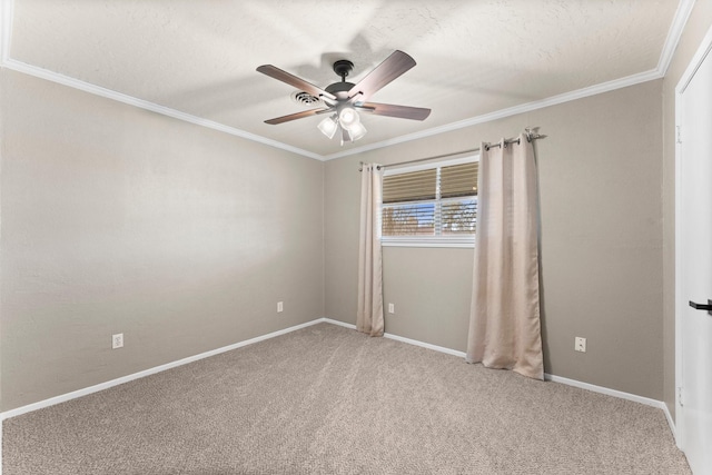 unfurnished room with ornamental molding, ceiling fan, and carpet