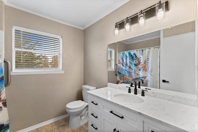 bathroom featuring ornamental molding, a healthy amount of sunlight, toilet, and vanity