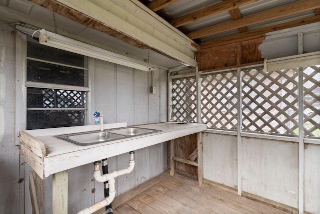 exterior space with sink and light wood-type flooring