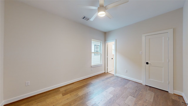 spare room featuring ceiling fan and light hardwood / wood-style flooring