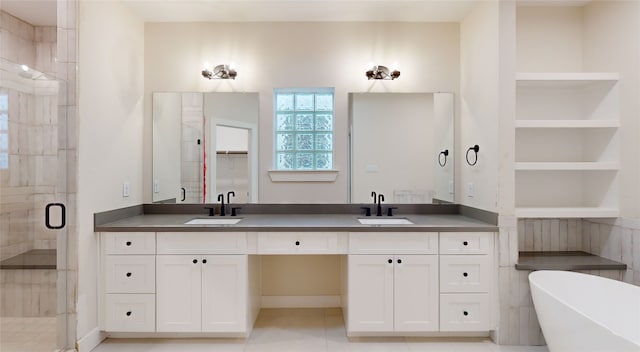 bathroom with separate shower and tub, built in shelves, tile patterned flooring, and vanity