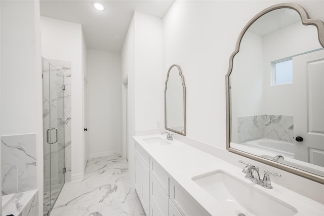 bathroom featuring shower with separate bathtub and vanity