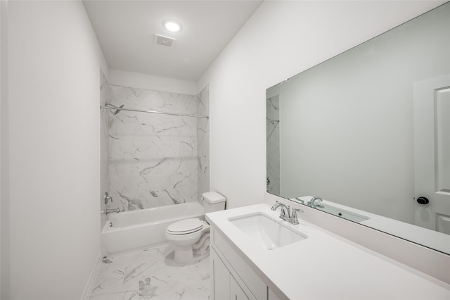 full bathroom with vanity, toilet, and tiled shower / bath