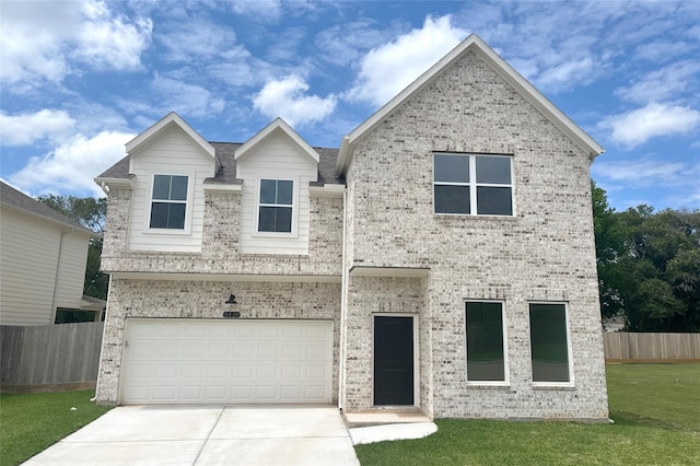 view of front of home with a front lawn and a garage