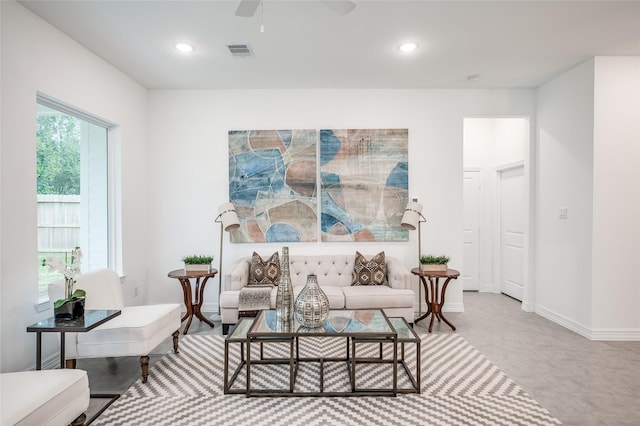 sitting room featuring ceiling fan