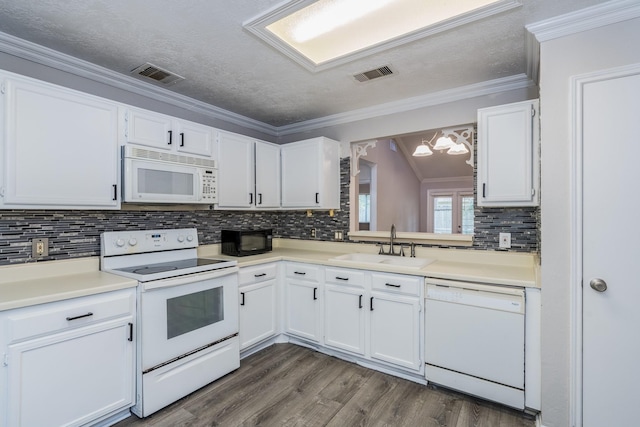 kitchen featuring white cabinets, decorative backsplash, white appliances, and sink