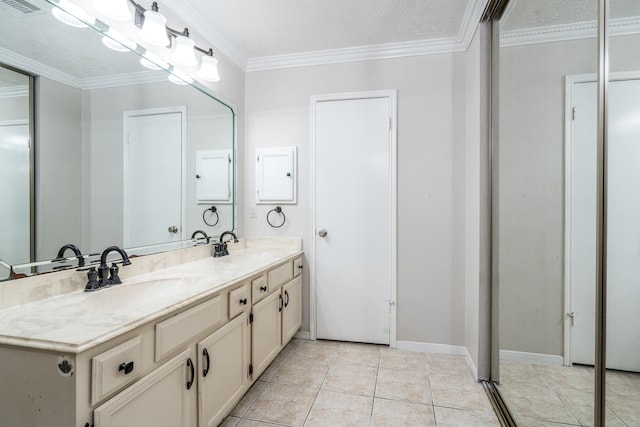 bathroom with tile patterned flooring, a textured ceiling, vanity, and crown molding