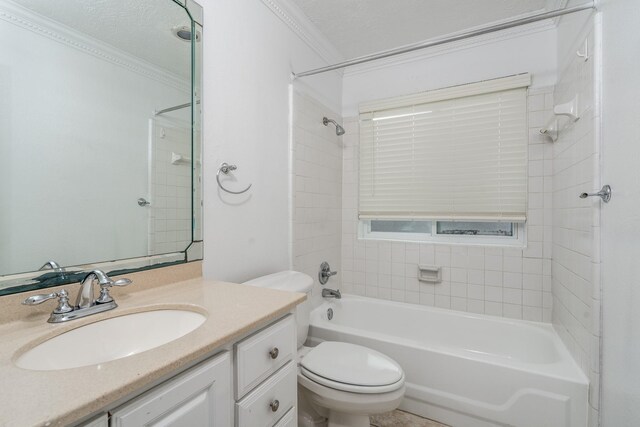 full bathroom with vanity, toilet, tiled shower / bath, and crown molding