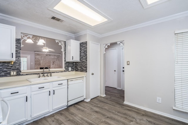 kitchen featuring white cabinets, sink, white dishwasher, and pendant lighting