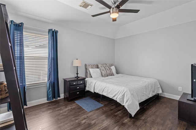 bedroom with ceiling fan, dark hardwood / wood-style flooring, lofted ceiling, and multiple windows