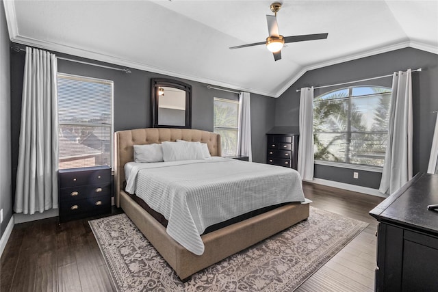 bedroom featuring dark hardwood / wood-style flooring, vaulted ceiling, ceiling fan, and crown molding