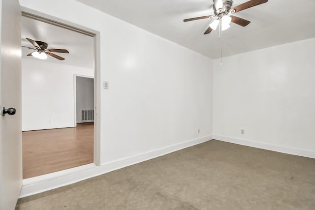 carpeted empty room with ceiling fan