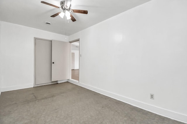 carpeted empty room with ceiling fan