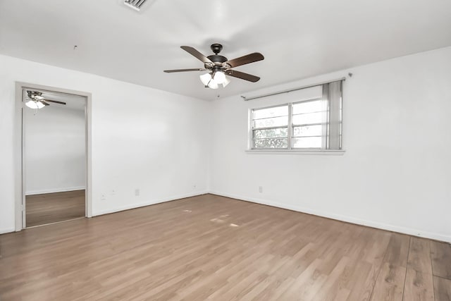 unfurnished room with ceiling fan and light hardwood / wood-style floors