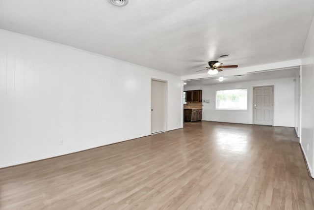 unfurnished living room featuring ceiling fan and light hardwood / wood-style floors