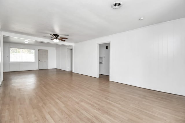 spare room featuring ceiling fan and light hardwood / wood-style flooring