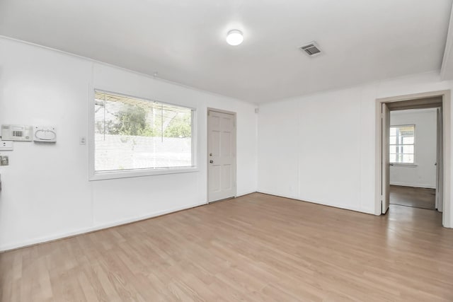 unfurnished room featuring light hardwood / wood-style flooring