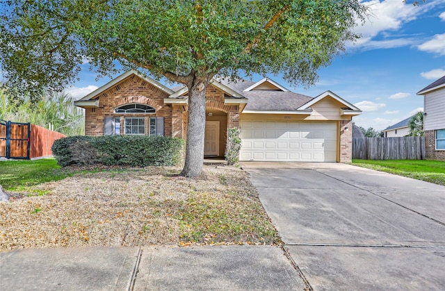 ranch-style house featuring a garage